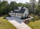 Elegant two-story home boasts a brick facade, a dark roof, and manicured landscaping at 40 Ridgeline Ct # 10, Pittsboro, NC 27312