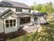A spacious backyard with a covered patio that has an outdoor grill ready for entertaining and relaxation at 40 Ridgeline Ct # 10, Pittsboro, NC 27312