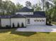 A lovely home featuring a well-manicured lawn, long driveway, and a three-car garage at 40 Ridgeline Ct # 10, Pittsboro, NC 27312
