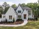 Elegant two-story home boasts a brick facade, a dark roof, and manicured landscaping at 40 Ridgeline Ct # 10, Pittsboro, NC 27312