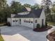 Charming two-story home featuring a well-manicured lawn, a long driveway, and a three-car garage at 40 Ridgeline Ct # 10, Pittsboro, NC 27312
