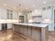 Open kitchen featuring a large island, stainless steel appliances, and hardwood floors at 40 Ridgeline Ct # 10, Pittsboro, NC 27312