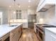 Modern kitchen with stainless steel appliances and center island with sink at 40 Ridgeline Ct # 10, Pittsboro, NC 27312