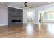 Open living room with a modern fireplace, staircase, and natural light at 40 Ridgeline Ct # 10, Pittsboro, NC 27312