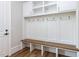 Well-organized mudroom featuring custom built-ins, hooks, a bench, and storage cabinets for shoes and outerwear at 40 Ridgeline Ct # 10, Pittsboro, NC 27312