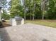 New outdoor kitchen area with built-in grill on a stone paver patio at 40 Ridgeline Ct # 10, Pittsboro, NC 27312
