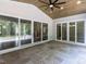 Relaxing covered outdoor patio with stone flooring, tongue and groove ceiling, and multiple doorways at 40 Ridgeline Ct # 10, Pittsboro, NC 27312
