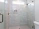 Bright shower offers glass door and convenient shower niche for storage at 40 Ridgeline Ct # 10, Pittsboro, NC 27312
