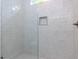 Bright walk-in shower is tiled in white with a glass door, showcasing modern elegance at 40 Ridgeline Ct # 10, Pittsboro, NC 27312