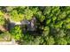 Aerial view of home nestled within green, leafy trees and a long driveway at 4005 Colleen Way, Kittrell, NC 27544