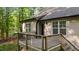Inviting back deck area features a wood deck, railings, and convenient access to the home and backyard at 4005 Colleen Way, Kittrell, NC 27544