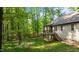 Backyard showing a deck, grassy lawn and treed lot at 4005 Colleen Way, Kittrell, NC 27544