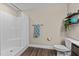 Bathroom with shower, toilet, and decorative shelving at 4005 Colleen Way, Kittrell, NC 27544