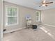 Neutral bedroom with ceiling fan and natural light from two windows at 4005 Colleen Way, Kittrell, NC 27544