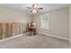Bedroom with ceiling fan, carpet, wood accent wall and natural light at 4005 Colleen Way, Kittrell, NC 27544