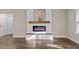 Modern fireplace with decorative mantel, shiplap detail, and an electric fireplace insert at 4005 Colleen Way, Kittrell, NC 27544