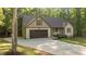View of a charming single Gathering home with a concrete driveway and attached garage at 4005 Colleen Way, Kittrell, NC 27544