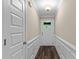 Bright foyer with dark hardwood floors and white wainscoting at 4005 Colleen Way, Kittrell, NC 27544