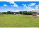 Lush green backyard, offering ample space for outdoor activities and relaxation at 47 Peduncle St, Selma, NC 27576