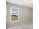 Bedroom featuring neutral walls, plush carpet, and a large window for natural light at 47 Peduncle St, Selma, NC 27576