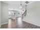Modern kitchen featuring stainless steel appliances, white cabinetry, kitchen island and wood flooring at 47 Peduncle St, Selma, NC 27576