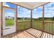 Inviting screened-in porch with wood flooring and a view of the serene backyard at 47 Peduncle St, Selma, NC 27576