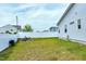 Expansive backyard with a manicured lawn, white fence, and potential for outdoor enjoyment at 49 Kathy Mae Ct, Angier, NC 27501
