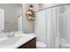 Well-lit bathroom with modern vanity, storage shelf, and shower at 49 Kathy Mae Ct, Angier, NC 27501