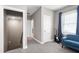 Hallway featuring plush carpet, a hall closet, with natural light from the window and adjacent bedroom at 49 Kathy Mae Ct, Angier, NC 27501