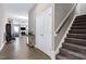 Open hallway with hardwood floors leading to a living room and staircase at 49 Kathy Mae Ct, Angier, NC 27501