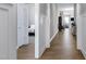 Inviting hallway with hardwood floors leading to a bedroom and living area with lots of space at 49 Kathy Mae Ct, Angier, NC 27501