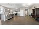 Spacious open-concept kitchen with gray cabinets, stainless steel appliances, and seating at the island at 49 Kathy Mae Ct, Angier, NC 27501