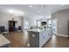 Open concept kitchen with granite island overlooking the living room at 49 Kathy Mae Ct, Angier, NC 27501