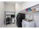 Practical laundry area with modern washer/dryer, sink, and desk; ideal for multitasking at 49 Kathy Mae Ct, Angier, NC 27501