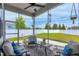 Relaxing screened-in patio featuring comfortable seating and views of the backyard at 49 Kathy Mae Ct, Angier, NC 27501