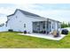 The spacious screened patio extends into the yard, framed by a privacy fence and green grass at 49 Kathy Mae Ct, Angier, NC 27501