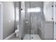 Modern tiled walk-in shower, offering a spa-like experience with built-in bench at 49 Kathy Mae Ct, Angier, NC 27501