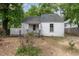 Quaint one-story house with a lattice-enclosed porch and compact yard at 511 E Maynard Ave, Durham, NC 27704