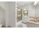 Bathroom features a walk-in shower with window, a sink, and vanity at 5112 Wolcott Ct, Fuquay Varina, NC 27526