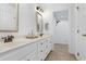 Bright bathroom featuring double sinks, decorative mirrors and a tiled shower at 5112 Wolcott Ct, Fuquay Varina, NC 27526