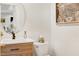 Well-appointed powder room with a stylish vanity, modern fixtures, and a decorative mirror at 5112 Wolcott Ct, Fuquay Varina, NC 27526