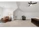 Spacious bedroom with vaulted ceilings, ceiling fan and comfortable seating at 5112 Wolcott Ct, Fuquay Varina, NC 27526