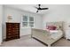 Bright bedroom featuring neutral decor, natural light, and a ceiling fan at 5112 Wolcott Ct, Fuquay Varina, NC 27526