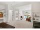 Open concept bedroom with built-in desk, large windows, seating, and plenty of natural light at 5112 Wolcott Ct, Fuquay Varina, NC 27526