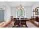 Elegant dining room with hardwood floors, a classic chandelier, and traditional furnishings, ideal for gatherings at 5112 Wolcott Ct, Fuquay Varina, NC 27526