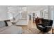 Open-concept living room seamlessly connected to the staircase and kitchen, promoting an inviting atmosphere at 5112 Wolcott Ct, Fuquay Varina, NC 27526