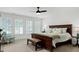 Serene main bedroom featuring a large bed, neutral decor, and ample natural light from the window at 5112 Wolcott Ct, Fuquay Varina, NC 27526