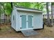 Backyard view of outdoor shed with double doors and ramp at 5112 Wolcott Ct, Fuquay Varina, NC 27526