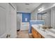 Bright bathroom featuring a soaking tub, glass enclosed shower and a double sink vanity at 5547 Sea Daisy Dr, Raleigh, NC 27606