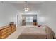 Bedroom with neutral walls, ceiling fan, furniture, and window allowing for natural light at 5547 Sea Daisy Dr, Raleigh, NC 27606